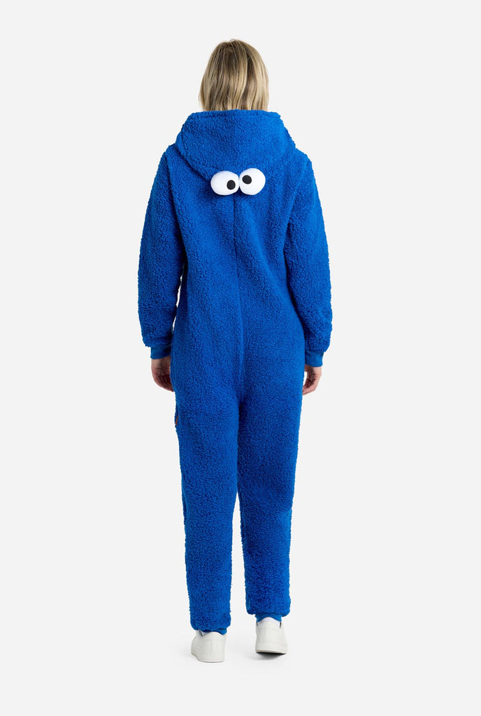 Woman wearing blue pluche Cookie Monster onesie for adults, view from the back