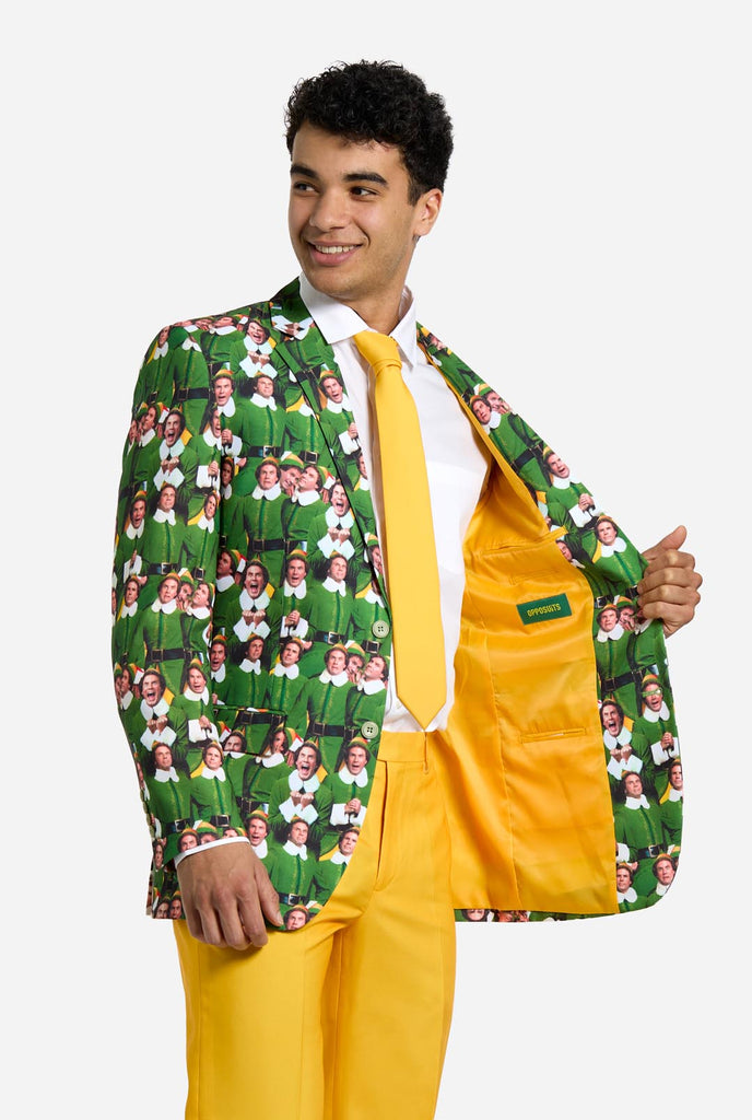 Man wearing men's Christmas suit with the character ELF on the jacket and yellow pants