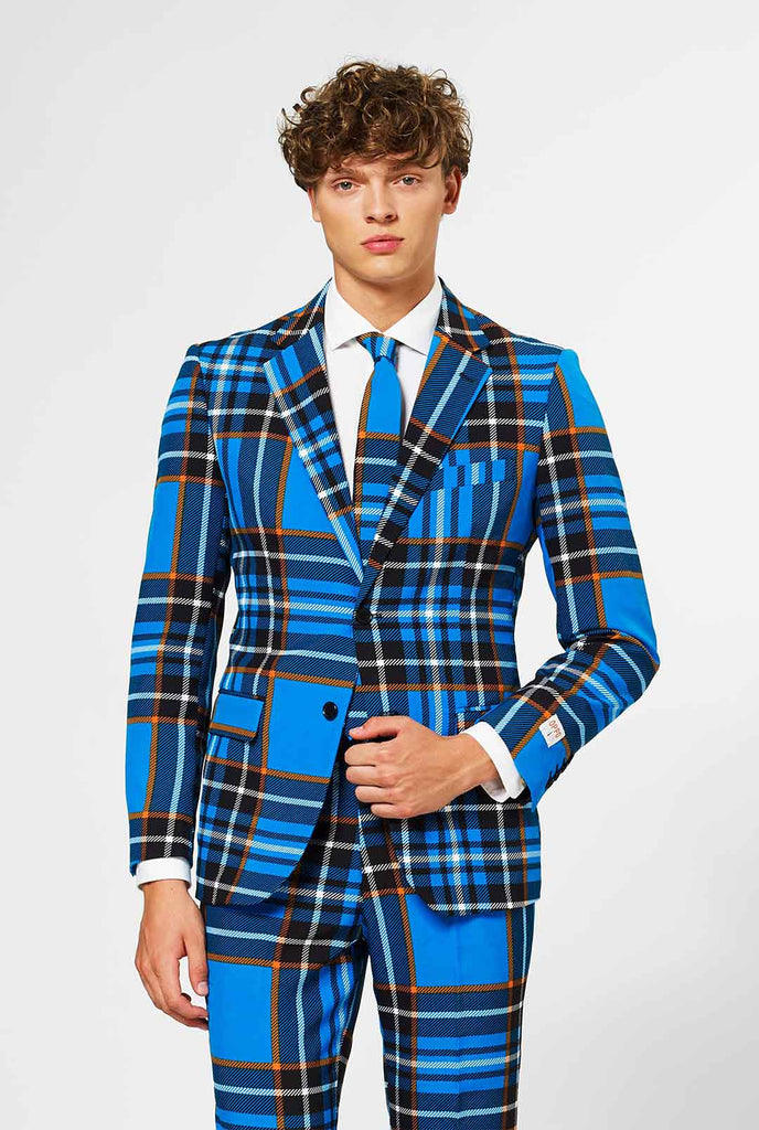 Man wearing blue tartan men's suit 