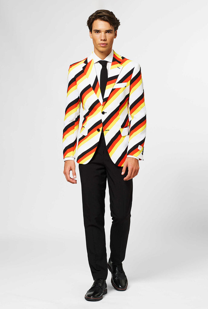 Man wearing German flag colored suit