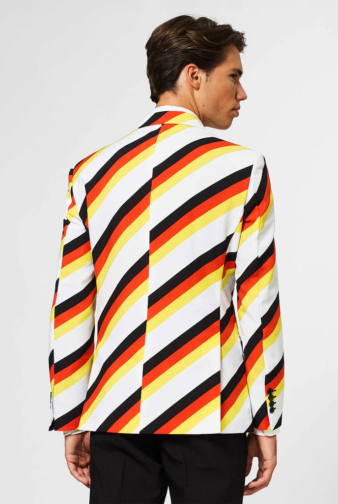 Man wearing German flag colored suit