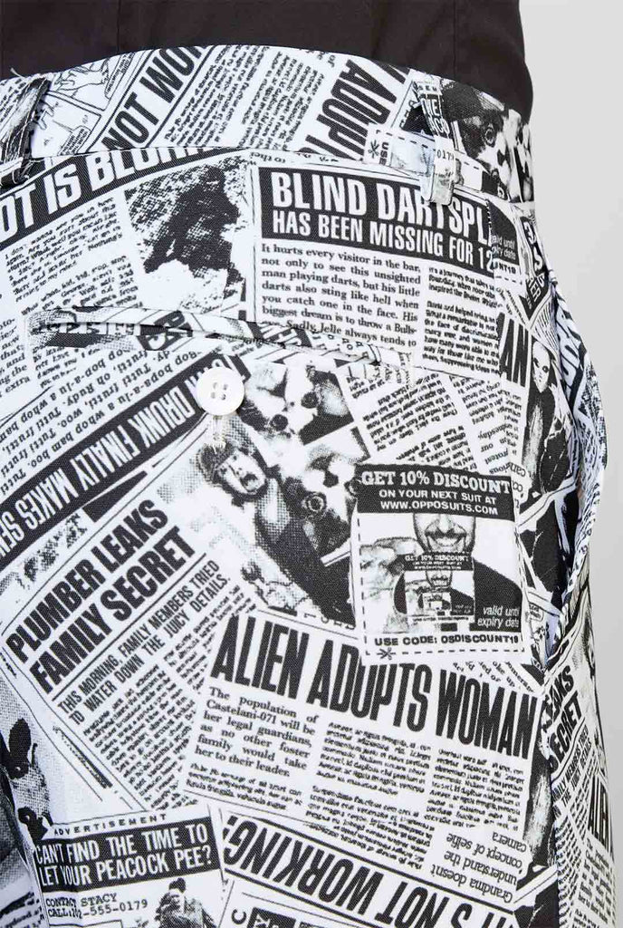 Funny newspaper print men's suit Textile Telegraph worn by man zoomed in