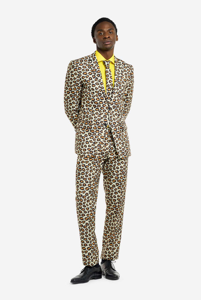 Image of a man wearing an OppoSuits The Jag men's suit with panther print and yellow men's shirt. Suit consist of pants, jacket and tie.