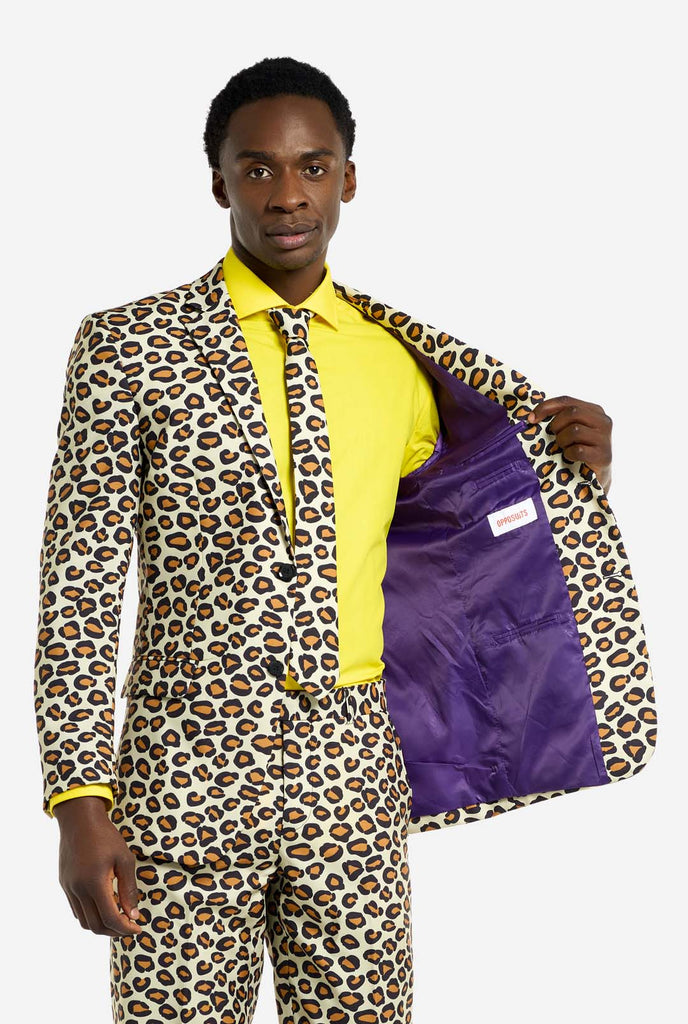 Image of a man wearing an OppoSuits The Jag men's suit with panther print and yellow men's shirt. Suit consist of pants, jacket and tie.