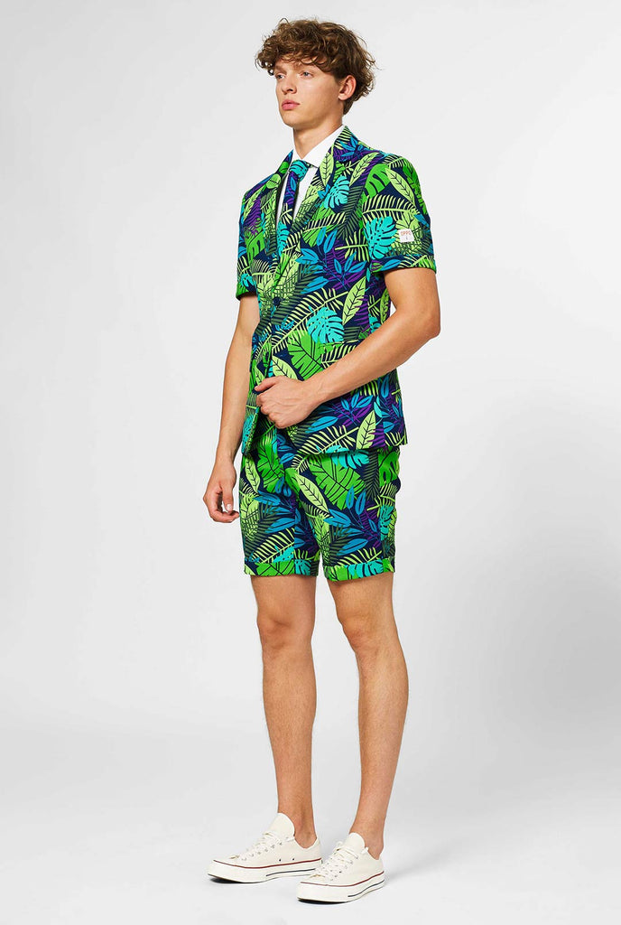 Man wearing green summer suit with jungle leaf print