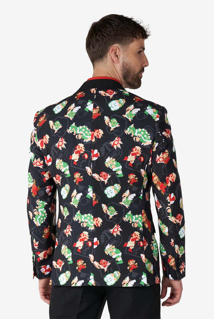 Man wearing black blazer with retro Super Mario characters print