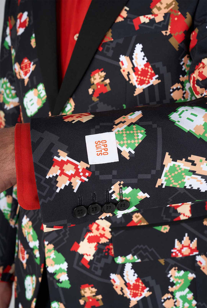 Man wearing black blazer with retro Super Mario characters print