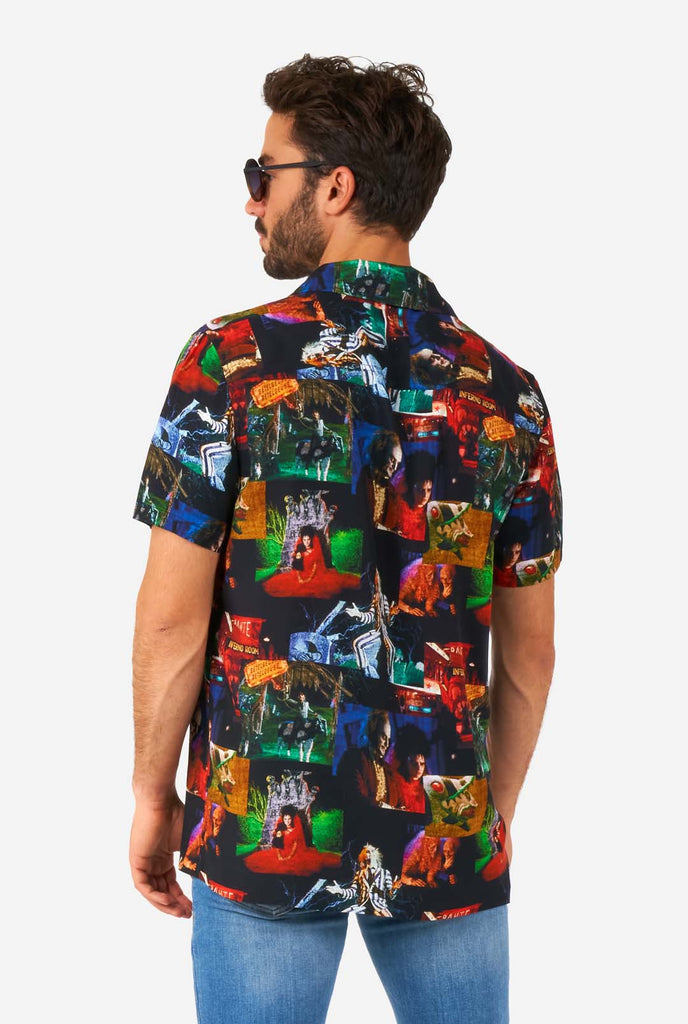 Man wearing Hawaiian shirt with Beetlejuice print, view from the back