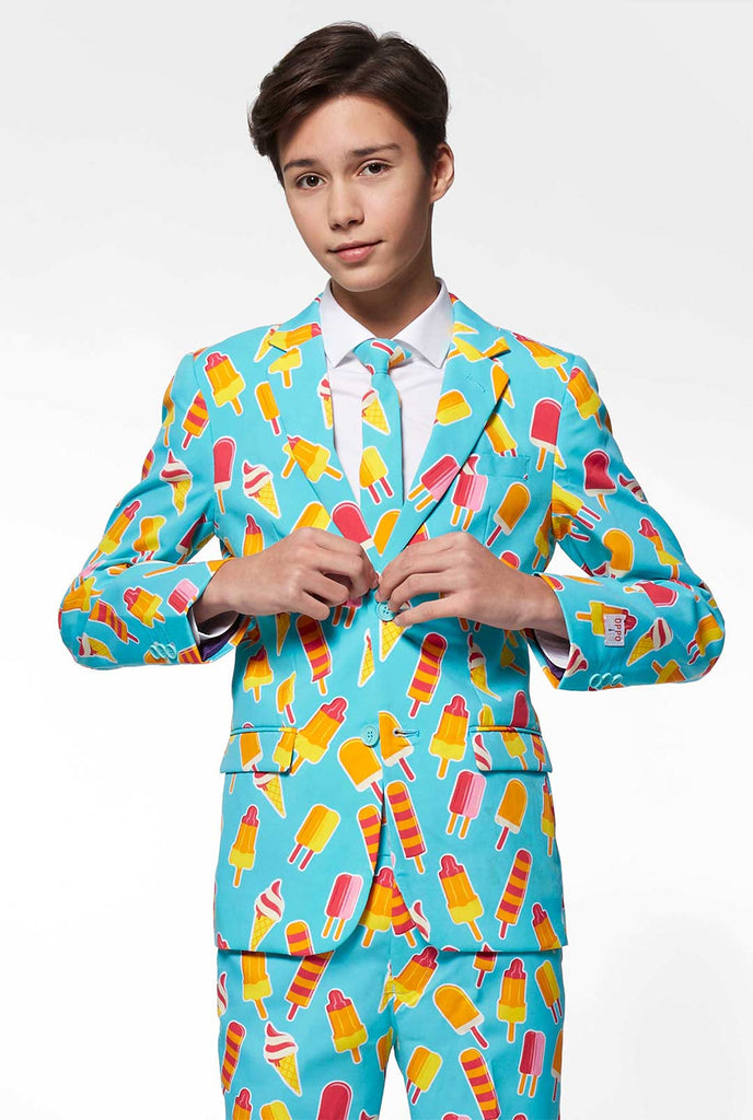 Teen wearing light blue formal suit with popsicle print