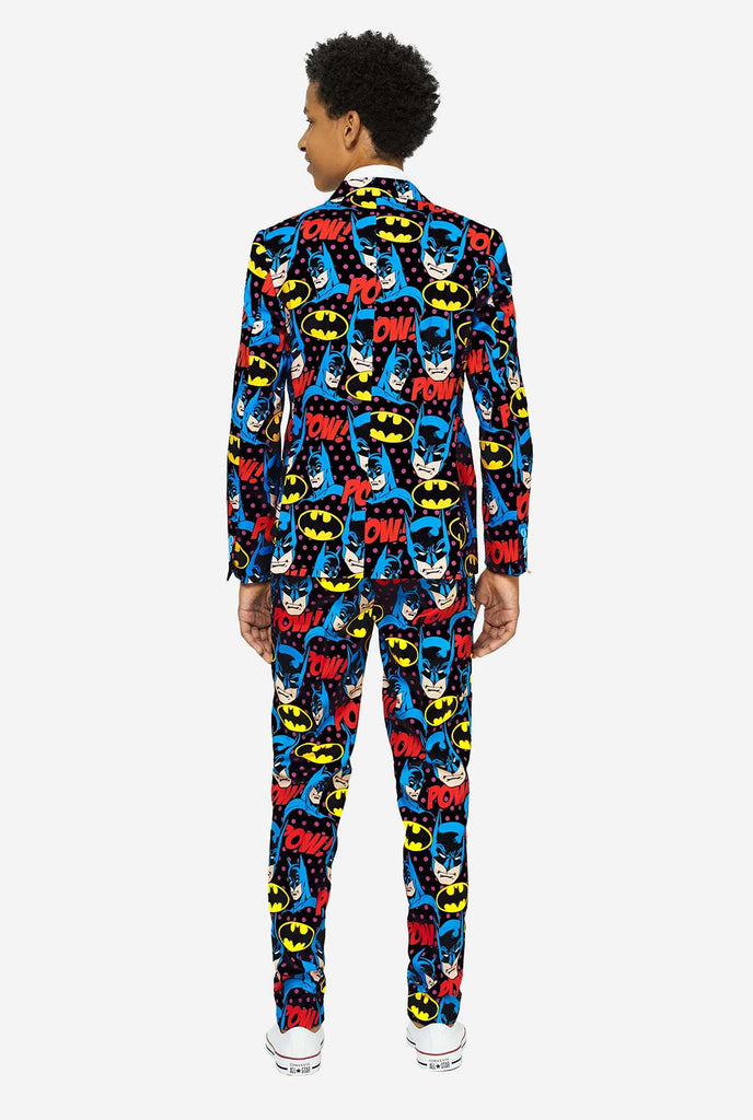 Teen wearing form suit with Batman print