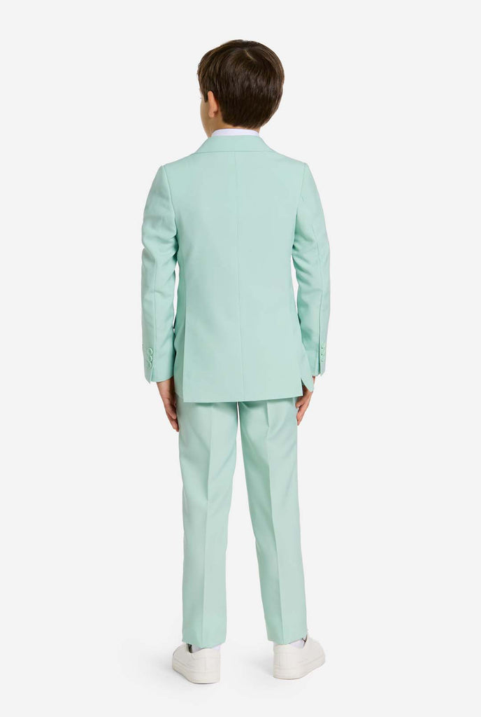 Kid wearing mint green boys suit, view from the back.