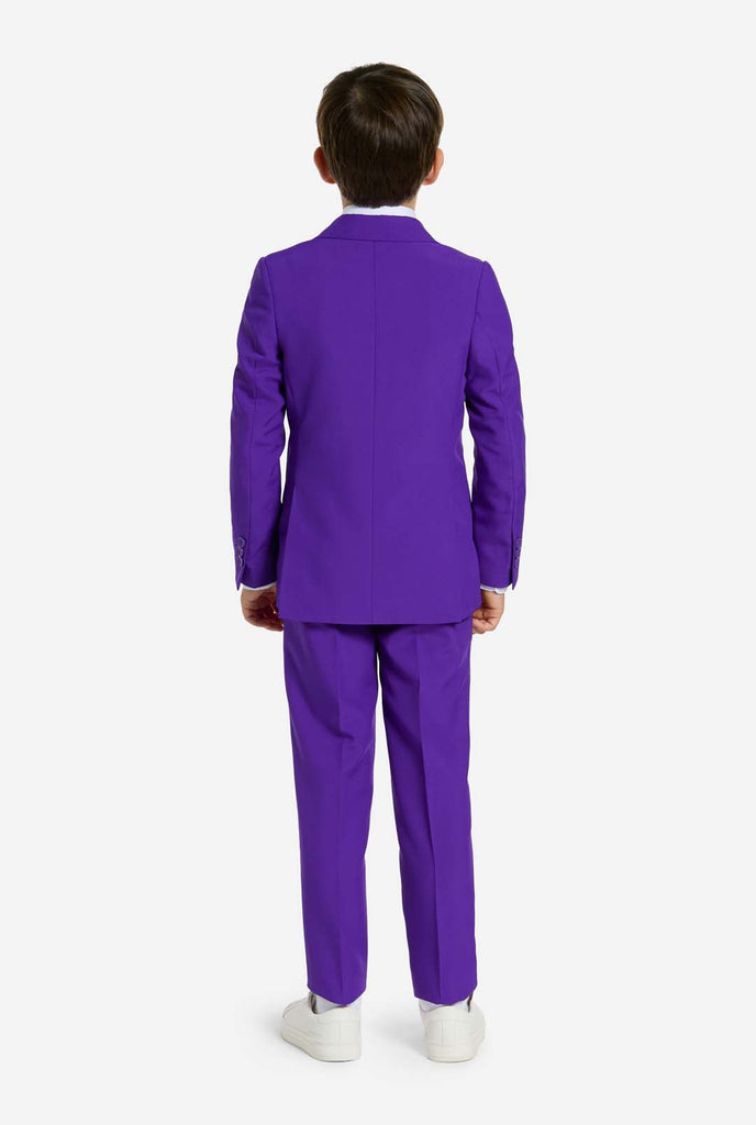 Kid wearing purple boys suit, view from the back