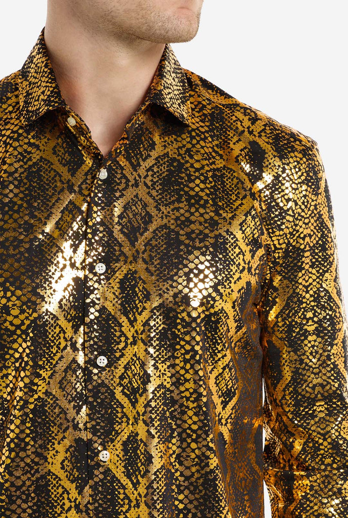 This image showcases a men’s dress shirt from OppoSuits, featuring a striking gold and black snakeskin print pattern. The shirt’s fabric has a glossy finish that reflects light, creating a bold, high-fashion look perfect for making a statement. With a detailed reptile-inspired pattern, this shirt is ideal for anyone looking to bring some edgy style to their wardrobe.