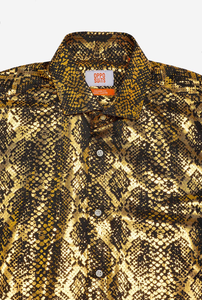 This image showcases a men’s dress shirt from OppoSuits, featuring a striking gold and black snakeskin print pattern. The shirt’s fabric has a glossy finish that reflects light, creating a bold, high-fashion look perfect for making a statement. With a detailed reptile-inspired pattern, this shirt is ideal for anyone looking to bring some edgy style to their wardrobe.