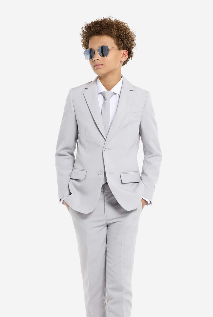 Teen wearing grey formal suit and sunglasses