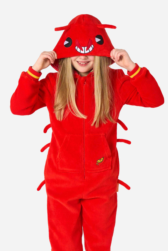 A kid is wearing a bright red lobster-themed kids onesie featuring playful hood details and cozy, soft material.